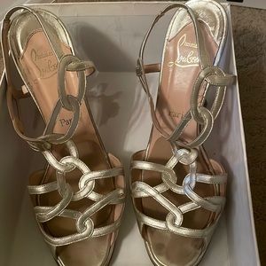 Gold strappy Louboutins